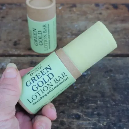 open.webp Green Gold Lotion Bar pushed up to show amount of product in tube