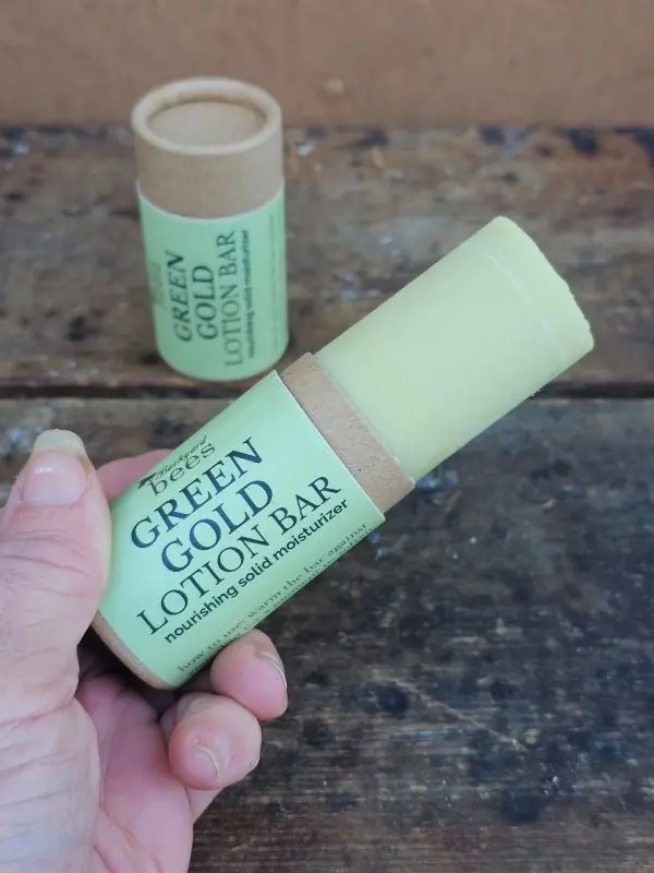 Green-Gold-Lotion-Bar-Open open.webp Green Gold Lotion Bar pushed up to show amount of product in tube