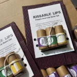 Lip balm trio new Trio of beeswax lip balms in paper tubes in cardboard packaging