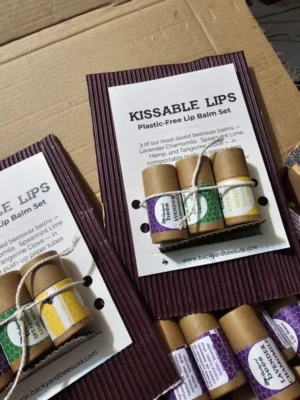Lip balm trio new Trio of beeswax lip balms in paper tubes in cardboard packaging