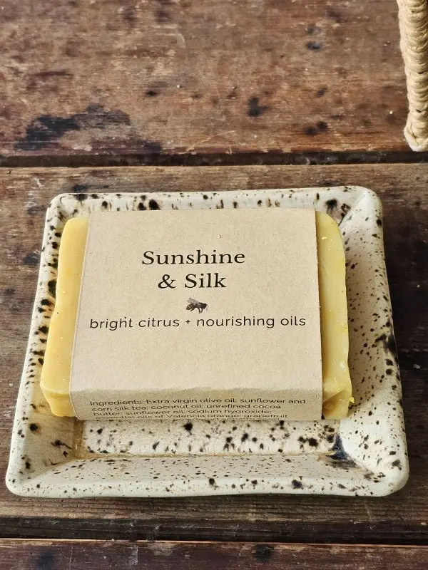 Sunshine and Silk citrus body soap on ceramic dish