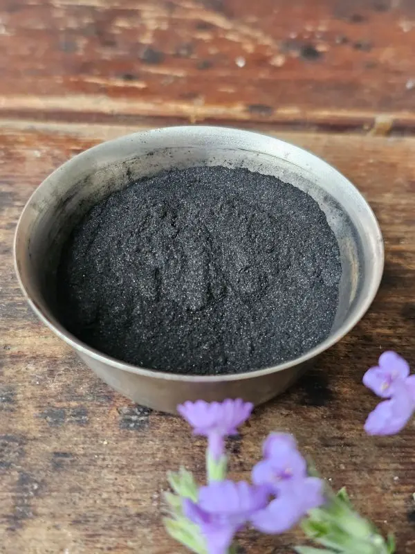 Activated charcoal powder and fresh lavender used in Velvet & Grit charcoal face scrub