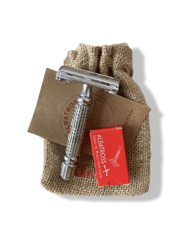 stainless steel safety razor and red box with replacement blades on burlap drawstring bag