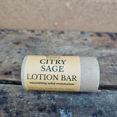 Citry-Sage-Lotion-Bar-Hero Citry Sage Lotion Bar in compostable paper tube on rustic wood background