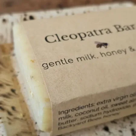 Closeup of Backyard Bees Cleopatra bar on rustic background