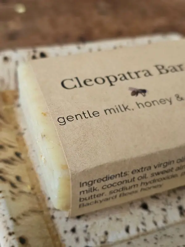 Closeup of Backyard Bees Cleopatra bar on rustic background