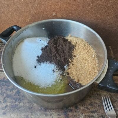 Handcrafted coffee calendula scrub texture with sea salt and turbinado sugar