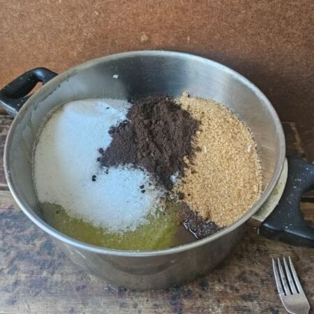 Handcrafted coffee calendula scrub texture with sea salt and turbinado sugar