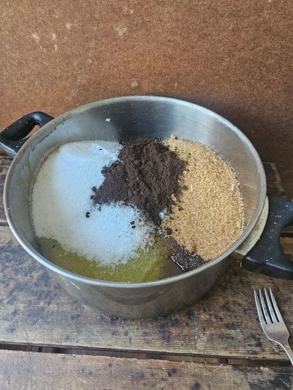 Handcrafted coffee calendula scrub texture with sea salt and turbinado sugar