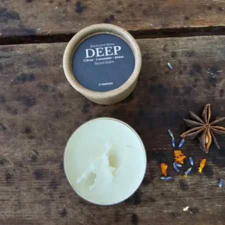 Open jar of DEEP beard balm showing the smooth beeswax-based balm inside.