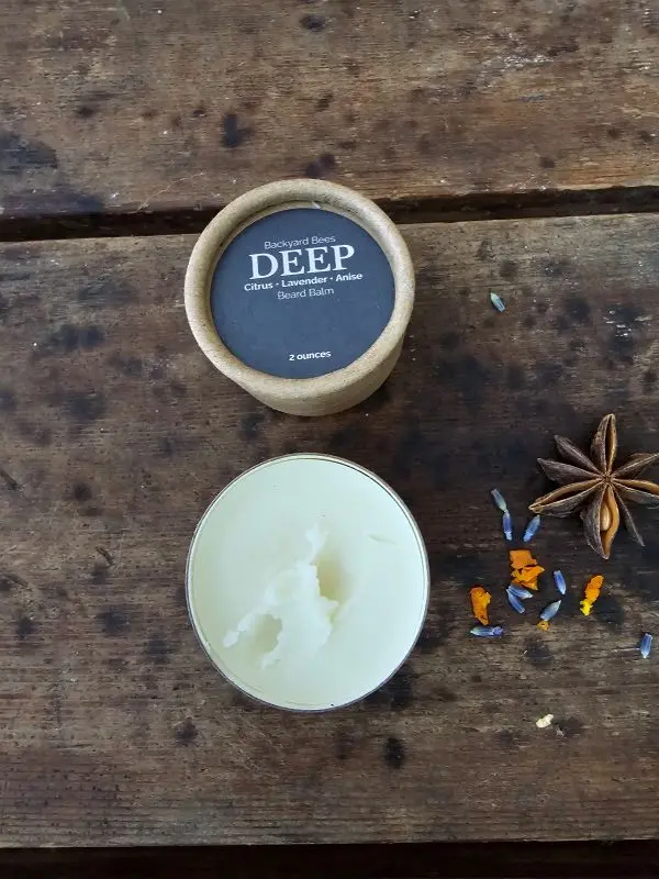 Open jar of DEEP beard balm showing the smooth beeswax-based balm inside.