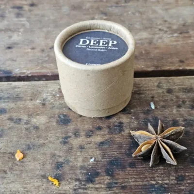 DEEP beard balm by Backyard Bees in a kraft jar, a citrus, lavender, and anise beard balm for daily grooming.