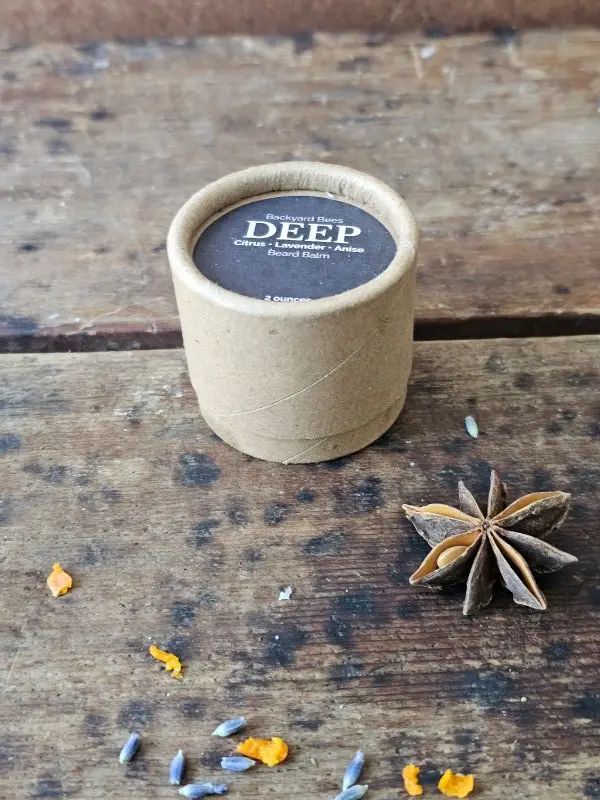 DEEP beard balm by Backyard Bees in a kraft jar, a citrus, lavender, and anise beard balm for daily grooming.
