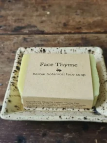 Face Thyme natural facial soap by Backyard Bees on a rustic table