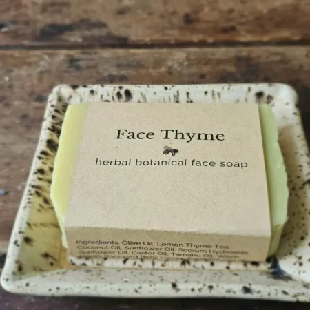 Face Thyme natural facial soap by Backyard Bees on a rustic table