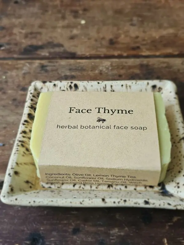 Face Thyme natural facial soap by Backyard Bees on a rustic table