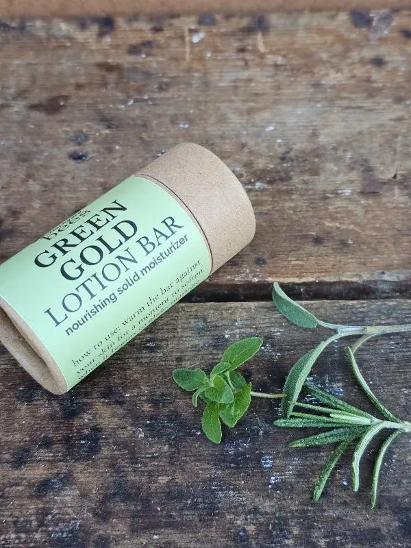 Green-Gold-Lotion-Bar-Herbs Green Gold Lotion Bar with fresh herbs highlighting botanical ingredients