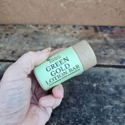 Green-Gold-Lotion-Bar-In-Hand Green Gold Lotion Bar held in hand for size and texture reference