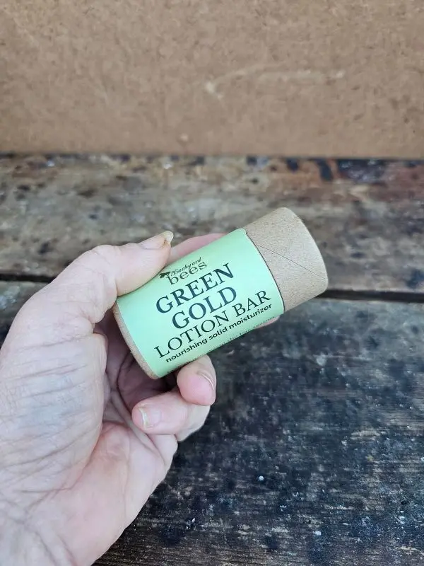 Green-Gold-Lotion-Bar-In-Hand Green Gold Lotion Bar held in hand for size and texture reference