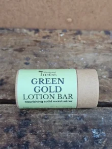 Green Gold Lotion Bar in compostable paper tube on neutral background