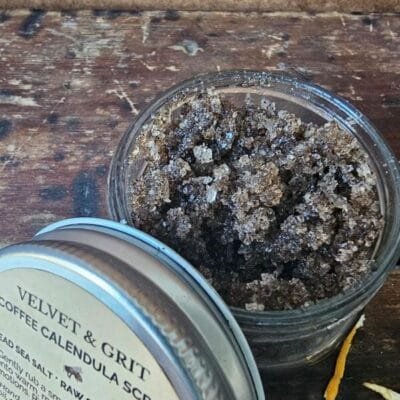 Coffee Scrub with calendula, showing sugar, salt and coffee exfoliating texture