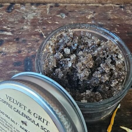 Coffee Scrub with calendula, showing sugar, salt and coffee exfoliating texture