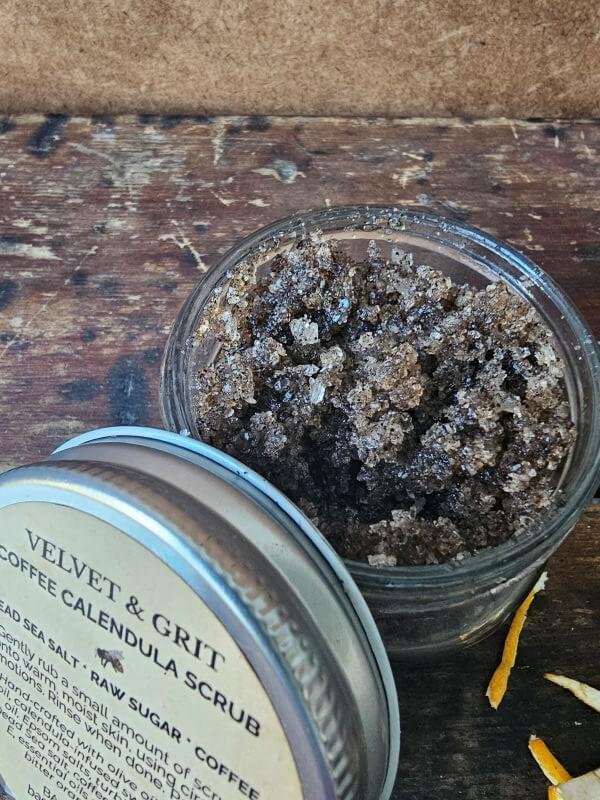 Coffee Scrub with calendula, showing sugar, salt and coffee exfoliating texture