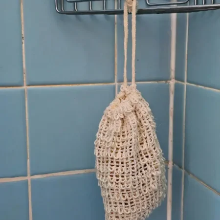 sisal soap saver bag hanging in shower