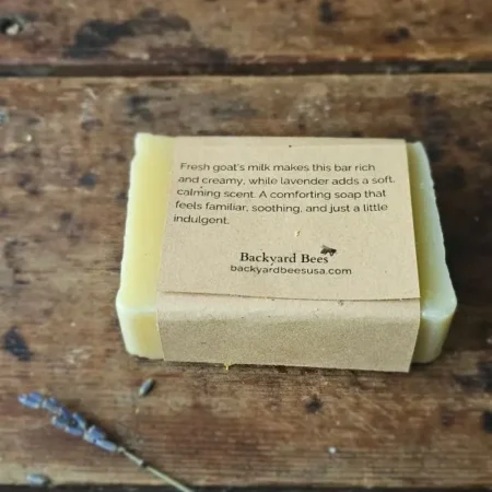 Back of Lavender Goat Milk soap label on rustic table with lavender sprig