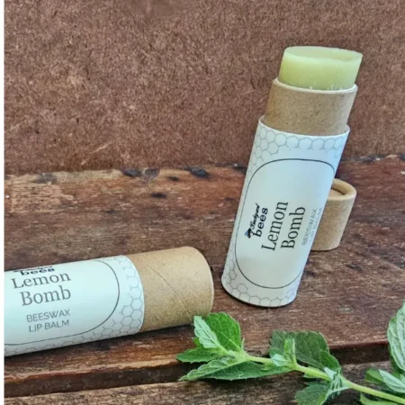 Lemon Bomb beeswax lip balm with cooling peppermint, tea tree, and clove essential oils