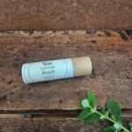 Natural beeswax lip balm in a compostable paper tube by Backyard Bees