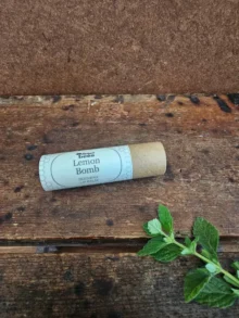 Natural beeswax lip balm in a compostable paper tube by Backyard Bees