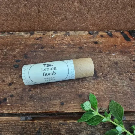 Natural beeswax lip balm in a compostable paper tube by Backyard Bees