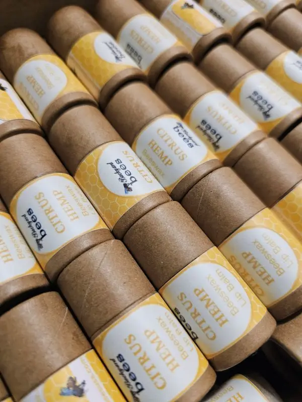 Lip Balm Citrus Close rows of Citrus Hemp Beeswax Lip Balms in paper tubes