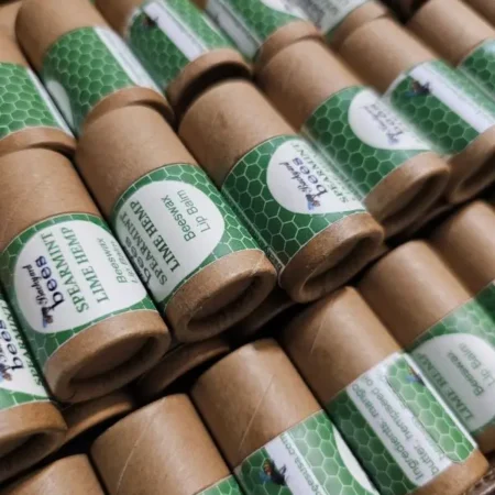 rows of plastic free lip balm in paper tubes - spearmint hemp flavor