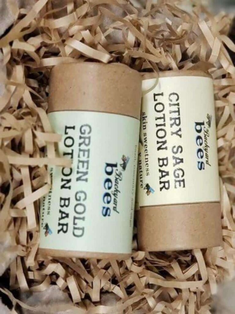 The Bee Barefoot lotion bar duo - Green Gold and Citry Sage- on a bed of brown paper shreds