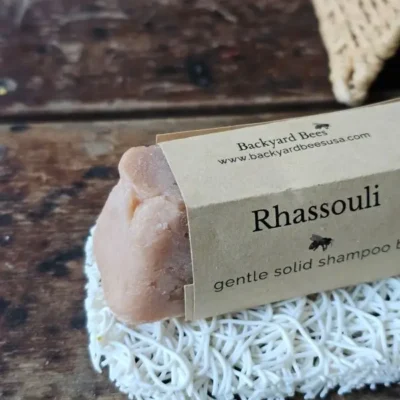 Close up of Rhassouli shampoo bar on white soap lift