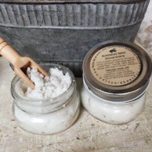 rosemary mint sugar scrub in small mason jars