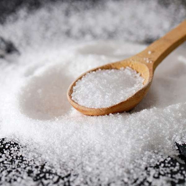 wooden tablespoon of fine white sea salt