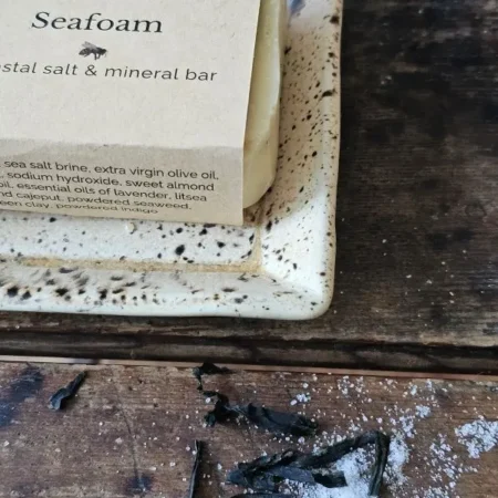 Natural Seafoam mineral bar with ingredients panel of dried seaweed and sea salt closeup
