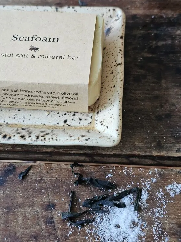 Seafoam With Seaweed And Sea Salt Natural Seafoam mineral bar with ingredients panel of dried seaweed and sea salt closeup
