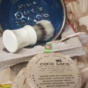 inside of wet shave bowl shown with shave brush and Coco loco vegan shave bar