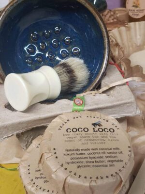 inside of wet shave bowl shown with shave brush and Coco loco vegan shave bar