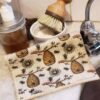 Swedish Dish Cloth bee-themed swedish dishcloths next to sink