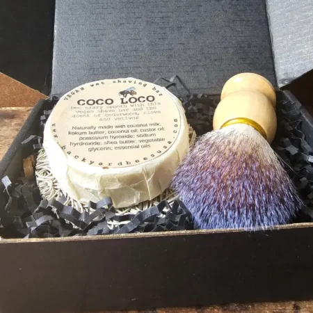 Close up of contents of mens wet shave starter set by Backyard Bees in black gift box