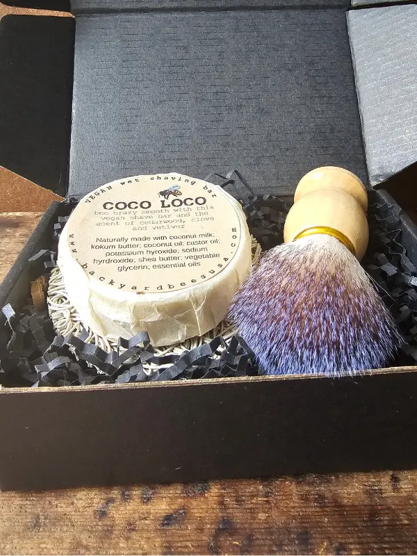 Close up of contents of mens wet shave starter set by Backyard Bees in black gift box