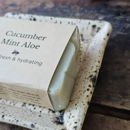 Close up of cucumber mint aloe soap on soap dish
