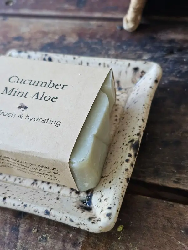 Close up of cucumber mint aloe soap on soap dish