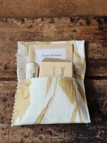 For the Gardener gift set in an open fabric envelope with Dirty Hands soap, cuticle stick, and zinnia seeds
