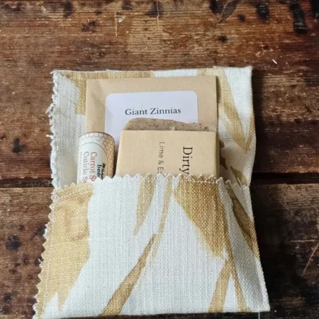 For the Gardener gift set in an open fabric envelope with Dirty Hands soap, cuticle stick, and zinnia seeds
